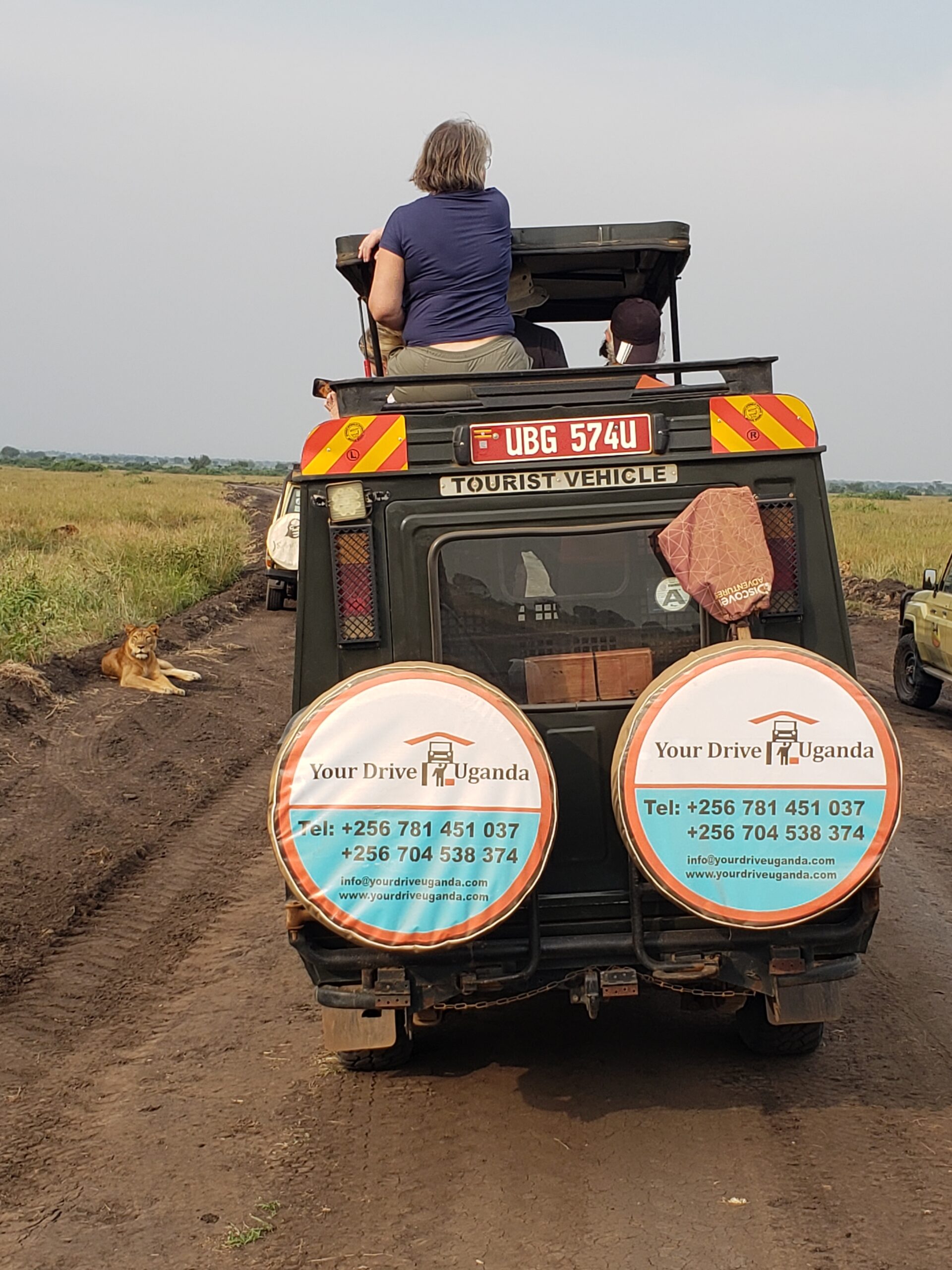 adventurers in extended on a uganda safari with a driver