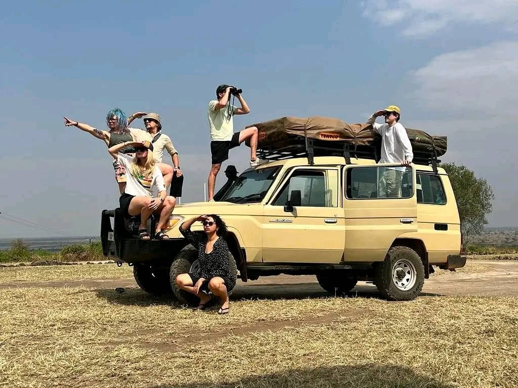 Adveturers on a land cruiser hardtop hire in uganda