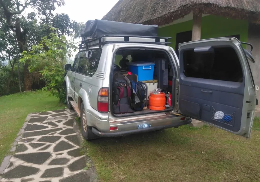 land cruiser tx rental in uganda with camping gear in the trunk
