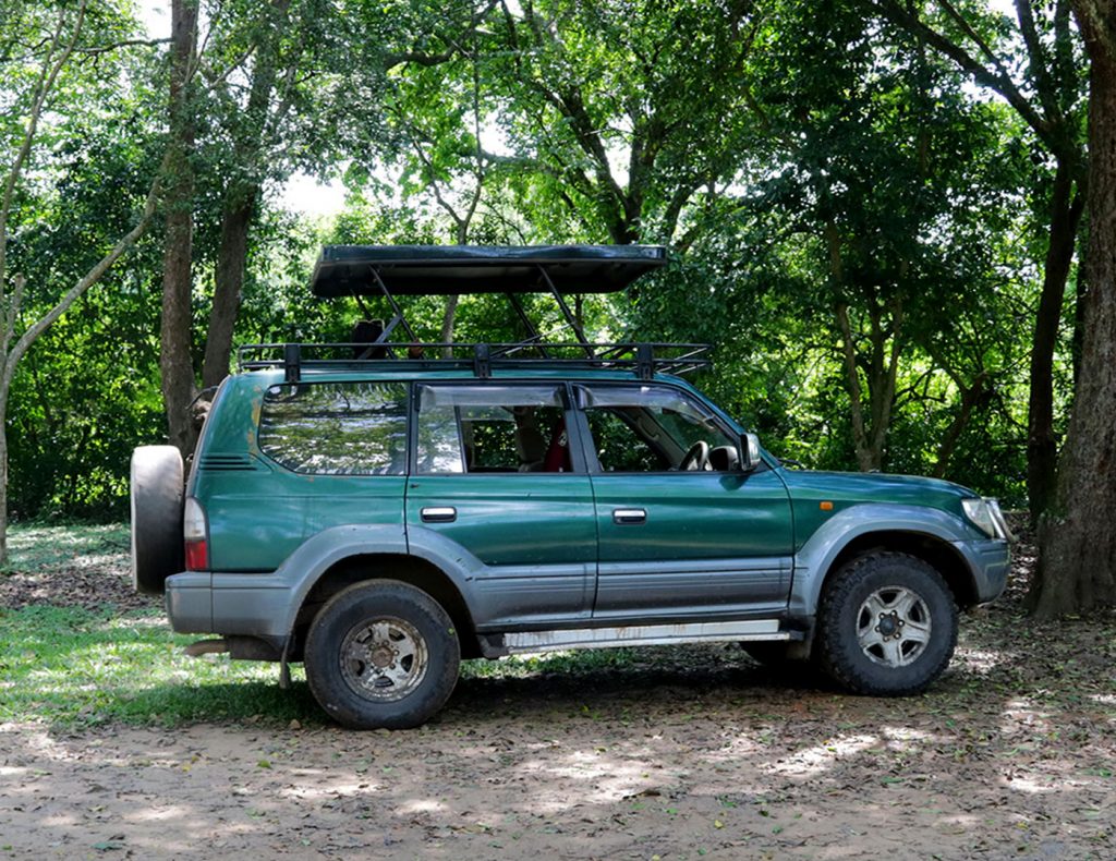 land cruiser tx rental in uganda with a pop up roof